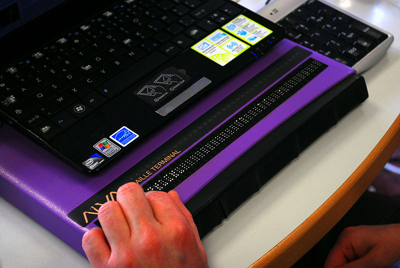  image of hands on an ORBIT READER
